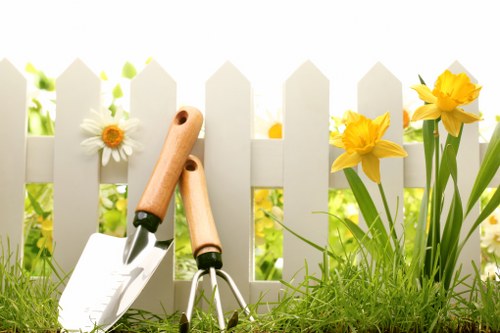 Local gardeners in Downham maintaining flower beds and lawns